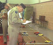 Section Commander George
Stauss inspects the entries.
