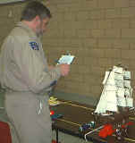 Commander Brian Jivan evaluates contestants.